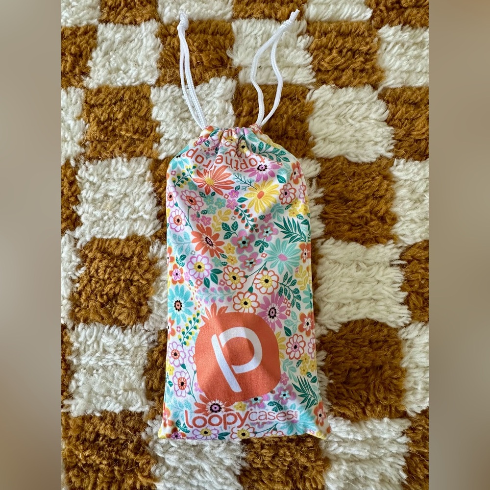 Loopy 14 Pro Max Floral Burst Phone Case with microfiber bag